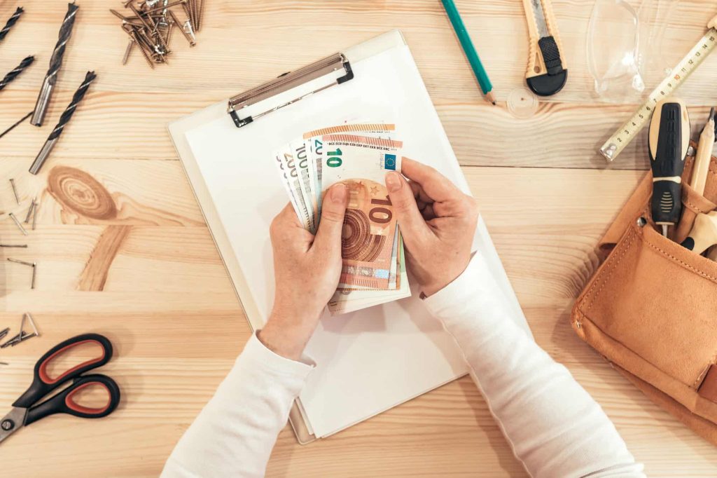 female carpenter counting money top view Cunningham Builds 2026